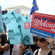 WASHINGTON, DC - JUNE 26: Protesters gather outside the U.S. Supreme Court as the court issued an immigration ruling June 26, 2018 in Washington, DC. The court issued a 5-4 ruling upholding the Trump administration’s policy imposing limits on travel from several primarily Muslim nations.
